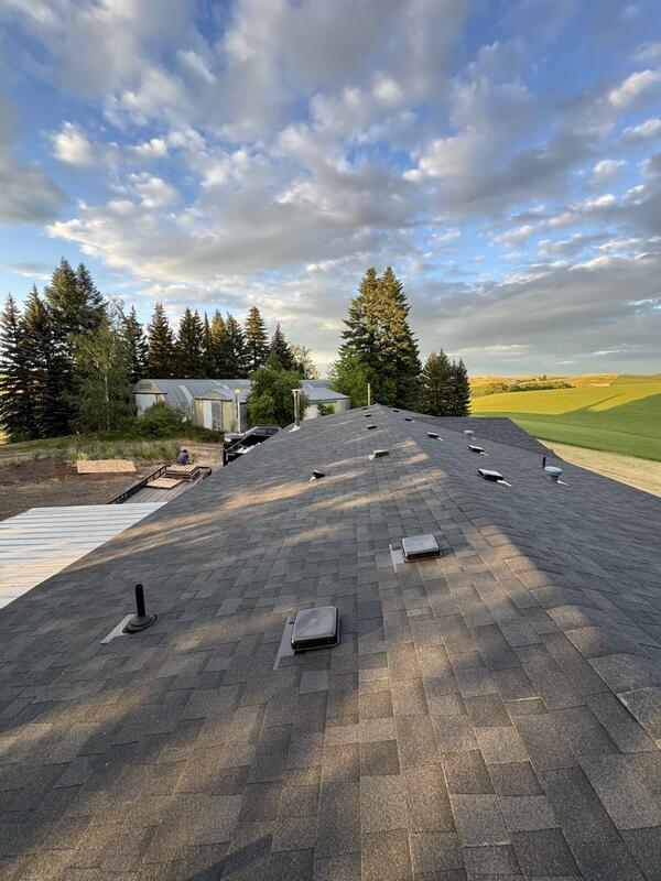 After: the same roof fully replaced with new architectural shingles