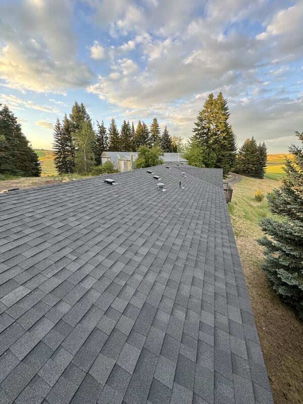 New roof installation on a rural home overlooking farmland
