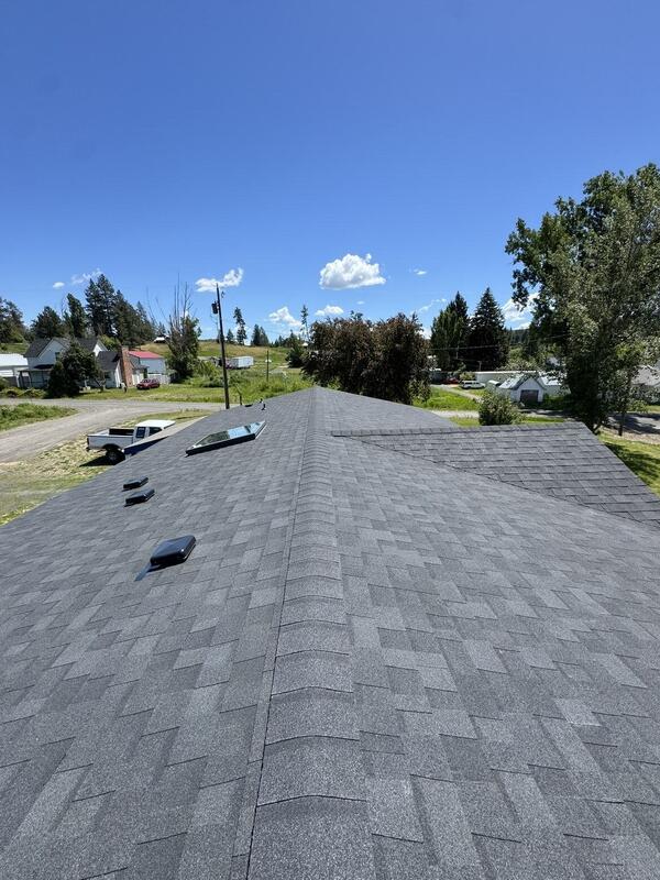 Long ridge line of a new roof above a valley