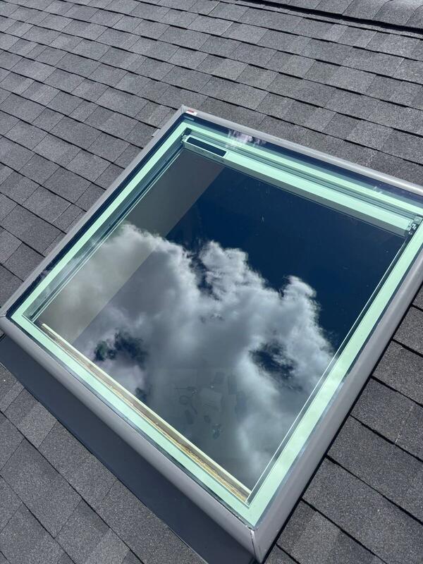 Close-up of a cleanly flashed skylight on new shingles
