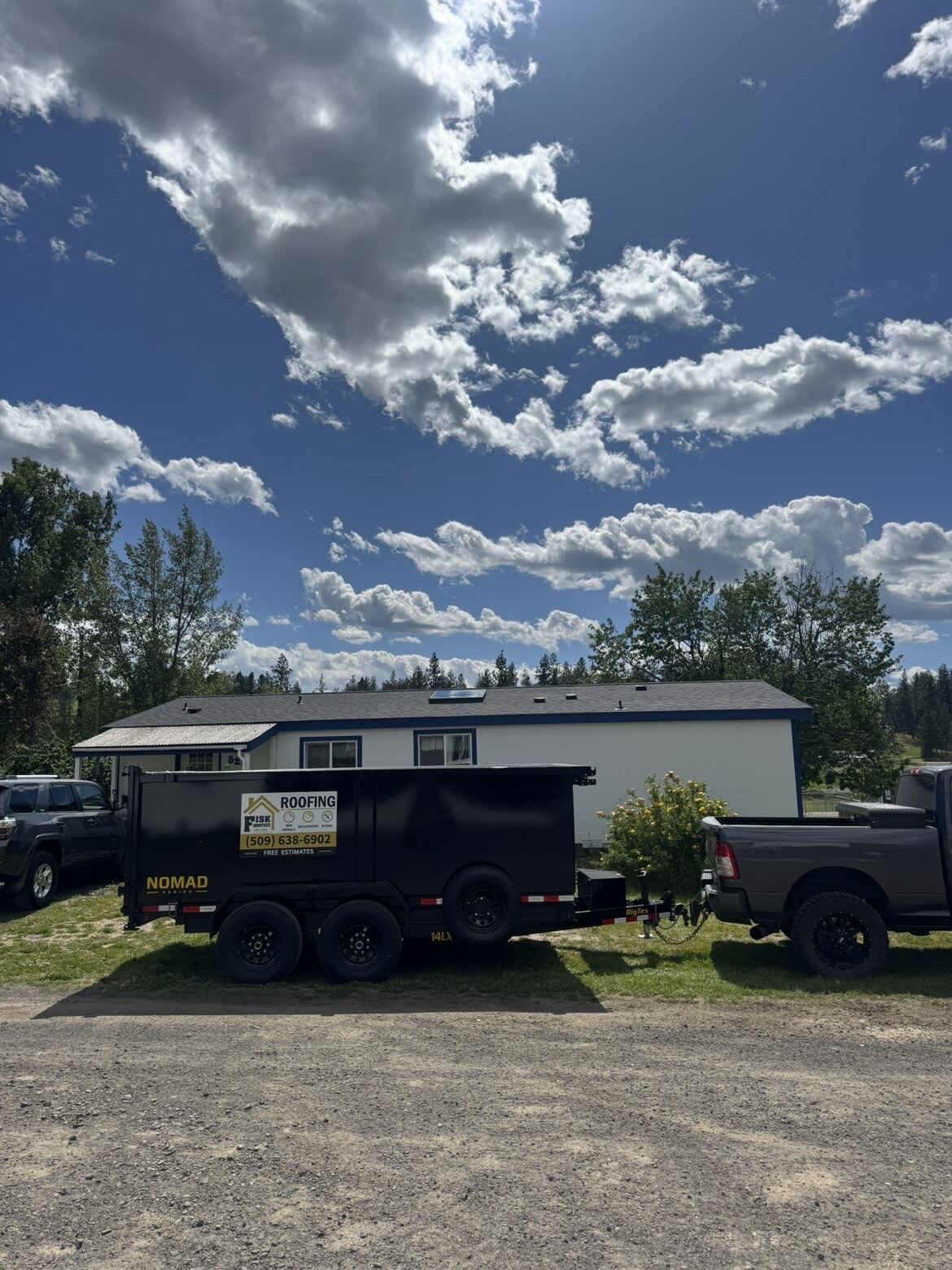 Fisk Industries branded equipment trailer on a residential job site